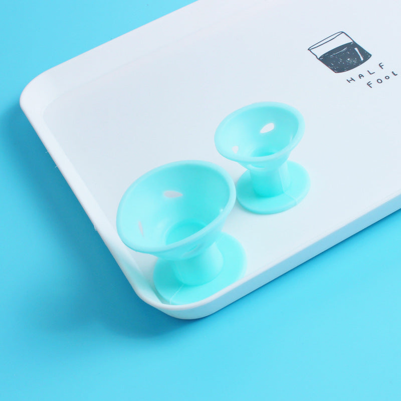 Set de bigoudis en silicone bleu de deux tailles (grande et petite) présentés dans plateau.