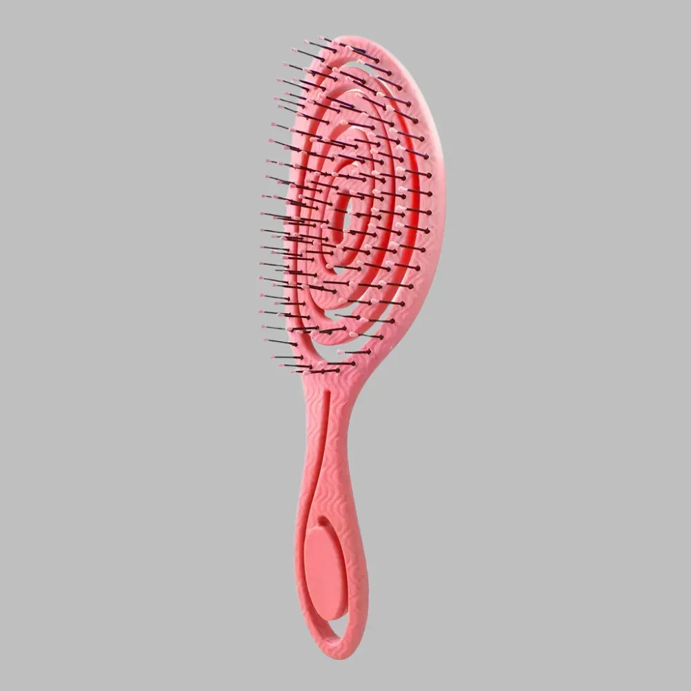 Brosse à cheveux rose ventilée avec picots pour cheveux bouclés sur fond gris
