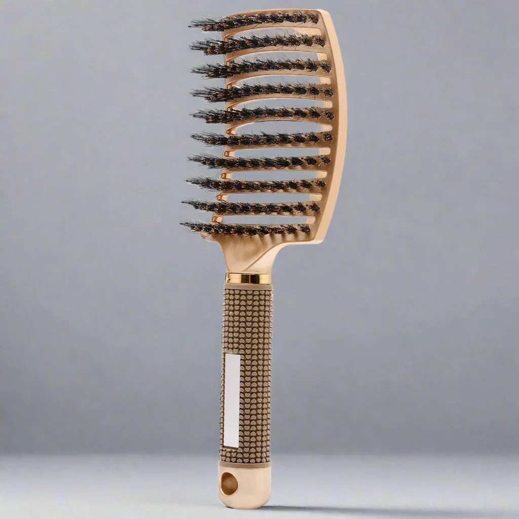 Brosse à cheveux dorée avec poils noirs espacés, manche texturé antidérapant