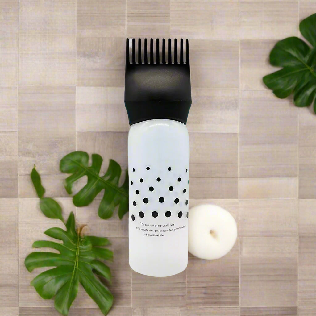 Applicateur d'huile noir, conçu pour une application précise et homogÚne des huiles capillaires ou pour le corps.