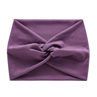 Bandeau cheveux violet en tissu stretch, idéal pour le sport ou une tenue décontractée