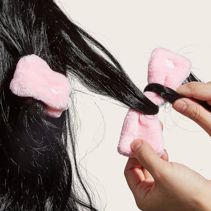 Lot de bigoudis roses doux pour mise en plis des cheveux à la maison