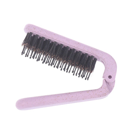 Brosse à cheveux pliable rose en poils de sanglier – compacte, naturelle et parfaite pour une retouche express