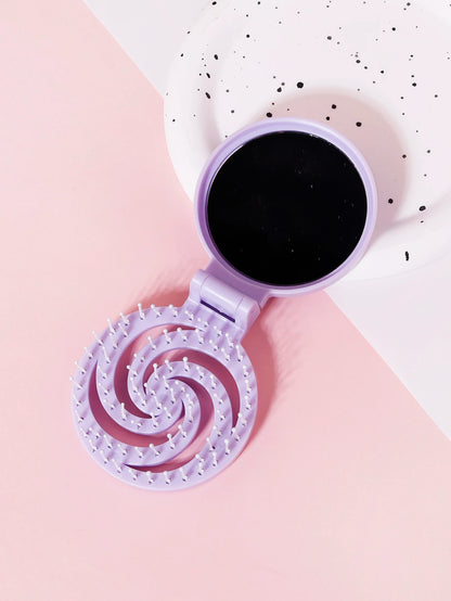 Brosse à cheveux de voyage avec miroir, de couleur violette, compacte et pratique pour des retouches rapides lors de vos déplacements