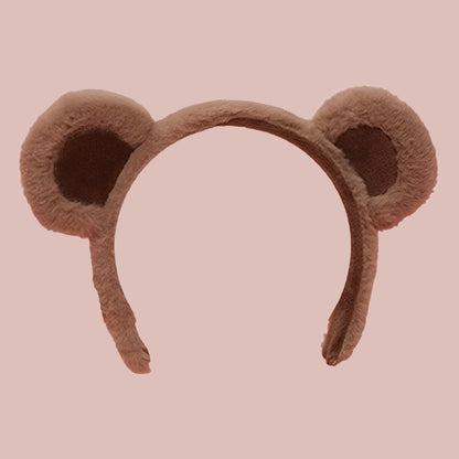 Serre-tête en peluche marron avec des oreilles d’ourson arrondies, idéal pour un déguisement ou un accessoire mignon