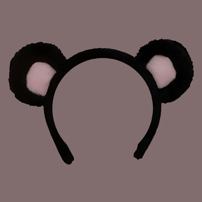 Serre-tête en peluche noir et rose avec des oreilles d’ourson arrondies, idéal pour un déguisement ou un accessoire mignon