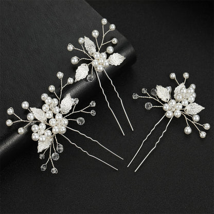Épingles à cheveux ornées de perles élégantes blanches et argentées, parfaites pour ajouter une touche de sophistication à vos coiffures. 