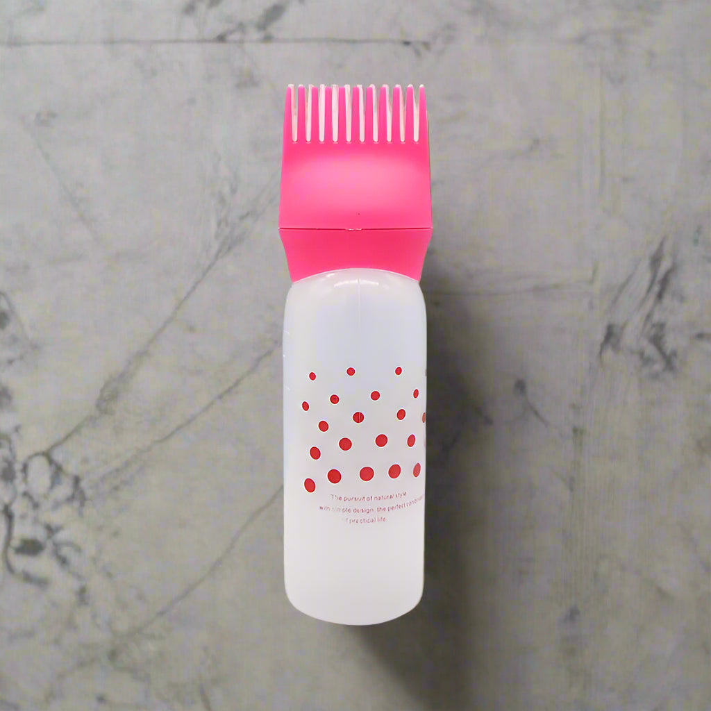 Applicateur rose  pour huile, avec embout doseur, idéal pour appliquer les huiles essentielles ou nourrissantes en toute simplicité et efficacité.